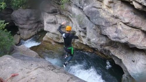 A big jump in gorges du loup for daring participants half day tour to discover canyoning in nice cote azur french riviera